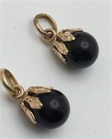 Pair Of 14k Gold And Black Charms