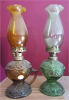 (2) Vintage color glass oil lamps.