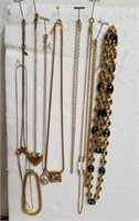 Group of necklaces with one bracelet