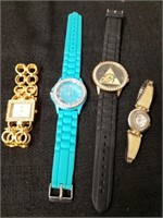Four watches the blue one inside is loose