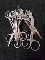 Large group of sutures scissors