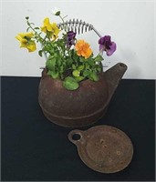 Vintage cast iron teapot with flowers