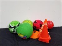 Group of kids balls with cones
