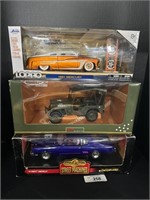 (3) Die Cast Collectible Cars.