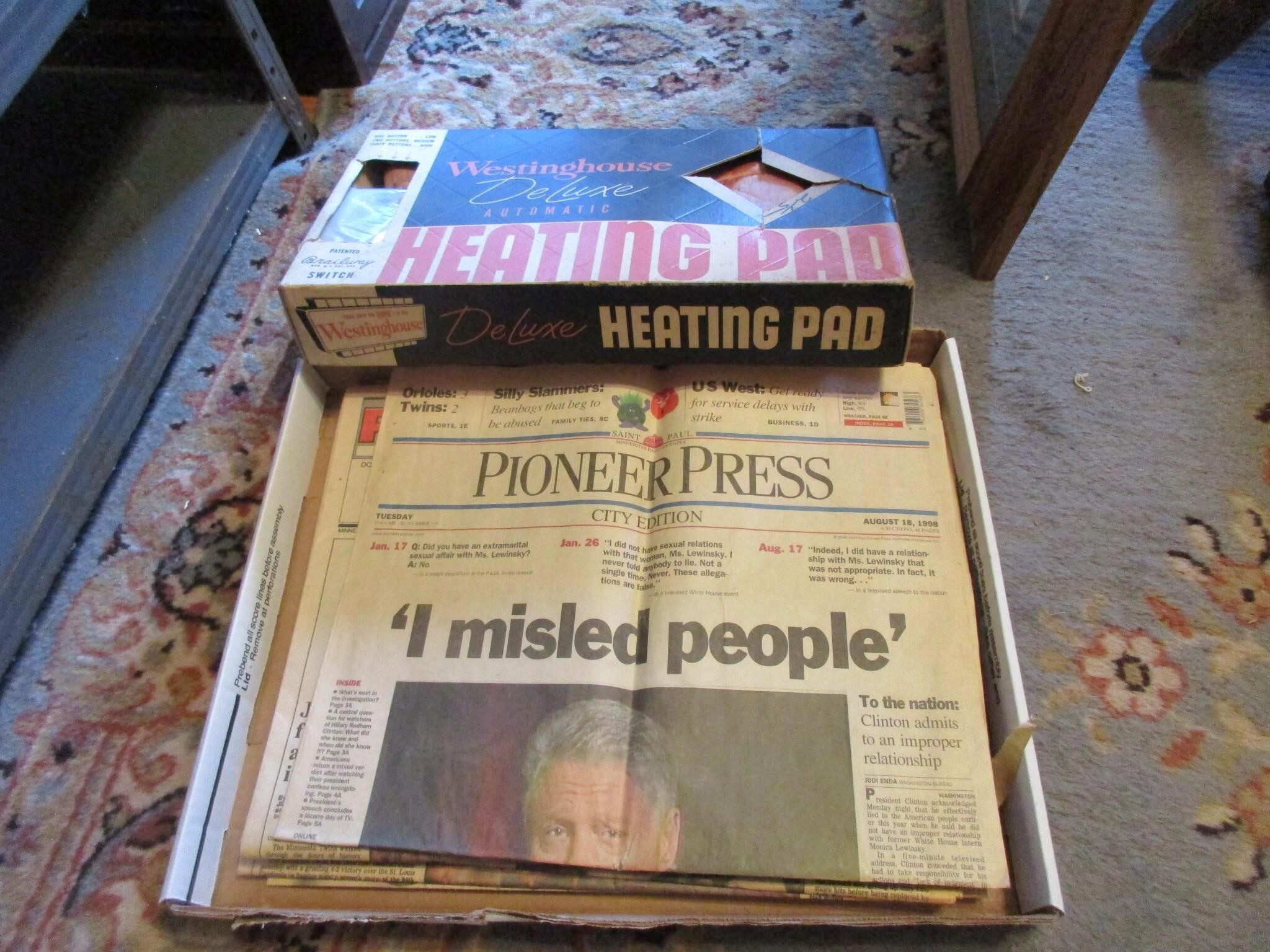 Vtg newspapers & heating pad