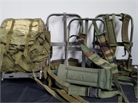 Three military backpack frames and one backpack