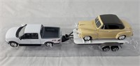 Diecast model of F-150 and 1948 Ford with trailer.