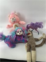 Stuffed animals: Care bear, pregnant dog with pupp