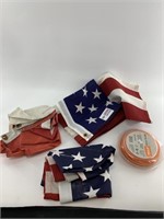 Two folding American flags and a weedwhacker spool