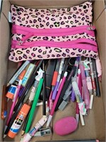 Pens markers glue sticks and bag