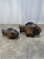 Primitive wooden and brass fish sculptures