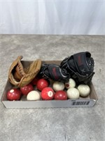 Vintage pool balls and children’s baseball gloves
