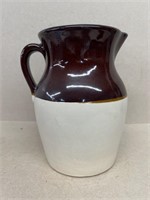 Brown and white stoneware pitcher