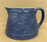 Stoneware blue pitcher with grape design
