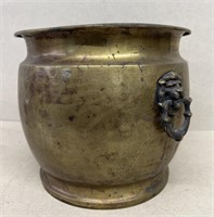 Brass pot with lion head handles