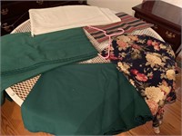 Tablecloths:  round floral and round green; green