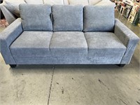 BASS W GREY COUCH RETAIL $3,500