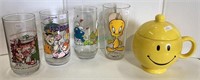 Lot includes four comic glasses and a lidded