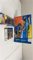 Assorted hot wheels including radical roadway