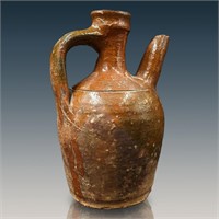 A Rare Pennsylvania Redware Spouted Jug With Many