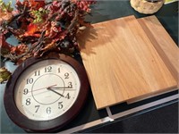 Two wooden bread boards & a clock