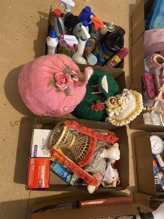 3 boxes cleaning supplies, decorative dolls, and