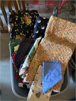 2 totes of fabric and 1 tote of yarn