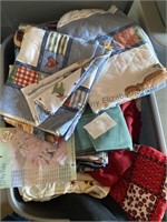 Two totes of fabric and 1 tote of fiberfill
