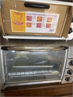 2 toaster ovens , one has not been used