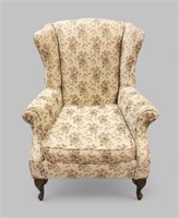 EARLY 20th CENTURY UPHOLSTERED WINGBACK ARMCHAIR