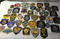 Collection of 40 Law Enforcement Badges