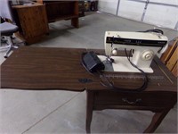 Sewing machine in cabinet as is
