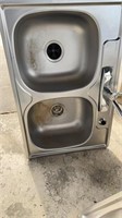 Stainless steel sink with some hard wear 33x22