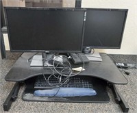 Two Dell computers with keyboard and Rising