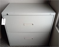 Beige two drawer metal filing cabinet with