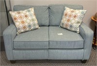 Blue couch with decorative pillows