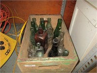 Old bottles in wooden Canada Dry Crate
