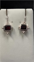 $90 silver coloured earrings