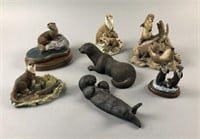 Collection of 7 Otter Figurines