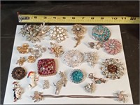 group of rhinestone pins & brooches few are
