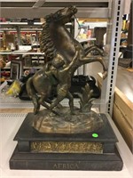 Cast metal. Africa statue on stand. 20x8x14