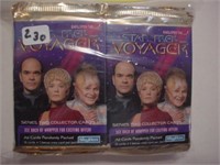 12 sealed packs of Star Trek Voyager cards,