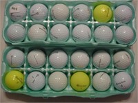 24 used Taylor made golf balls