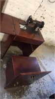 Domestic vintage sewing machine in cabinet