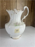 Vintage porcelain pitcher broken top