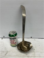 Silver in brass ladle