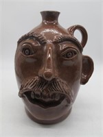 KIM T. BLACK POTTERY FACE JUG MISSING EAR 1986