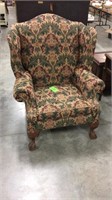 Vintage wing backed stuffed chair