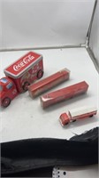 4 coca cola trucks