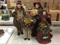 4 decorative caroling figures. Tallest is 18in.